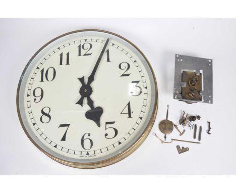 A large brass framed wall clock, 20th Century 46cm white face with Arabic numerals, later converted to electricity, small col