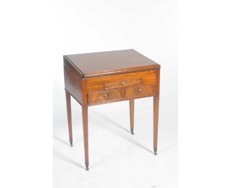 An early 19th Century clerks deskA sliding slope concealing a compartmentalised interior with six lidded compartments and a c