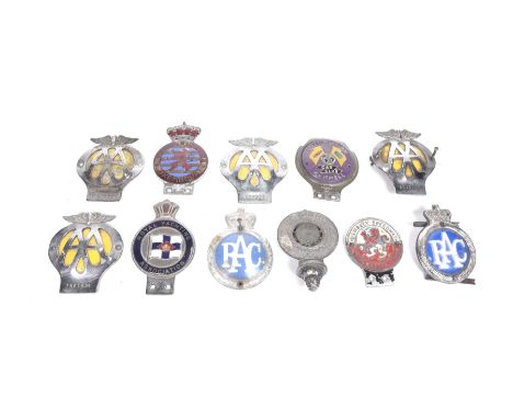 A collection of mid 20th Century car badges To include four AA badges, numbered 501, 318 (1962 - 67), OZ13982 (1945 -47), 8E2