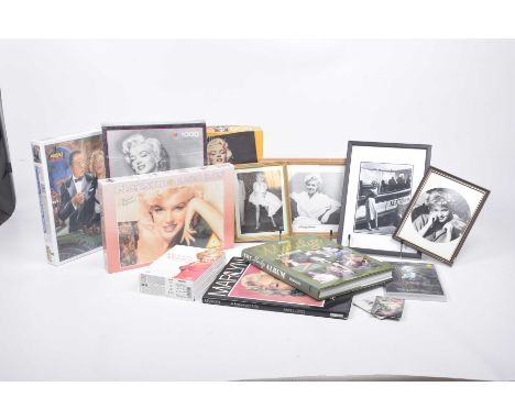 A large collection of pictures relating to Marilyn MonroeIncluding many framed pictures, stamps, the Marilyn Monroe DVD colle