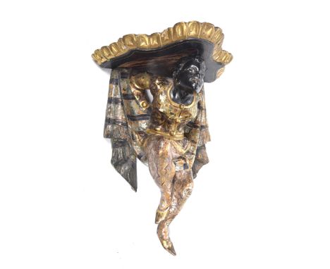 A carved gilt wood Venetian style blackamoor wall bracket Depicting a female figure dressed in elaborate Venetian dress befor