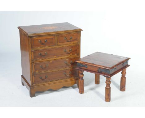 A reproduction yew wood chest of drawersThe rectangular moulded top centred with an inlaid oval foliate fan above an arrangem