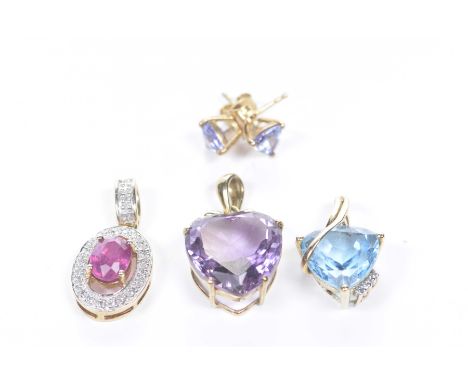 An amethyst pendantOf heart shaped, modelled in 9k gold, together with, a 9k gold and blue topaz pendant, a 9k gold, ruby and