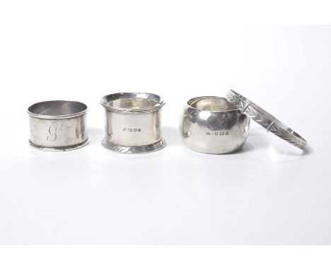 A group of silver napkin ringsTo include three Birmingham hallmarked examples of varying form, together with a silver engrave