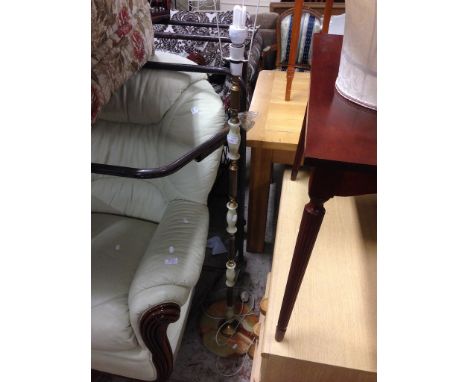 AN ONYX AND BRASS EFFECT STANDARD LAMP