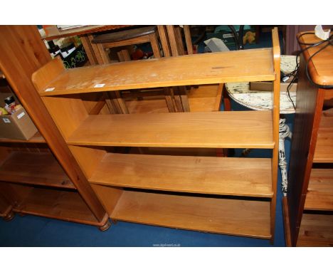 An open backed four shelf bookcase, 36" wide x 8 1/2" deep x 39 1/2" high.
