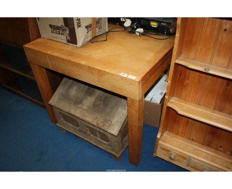 A light oak square, extending table.