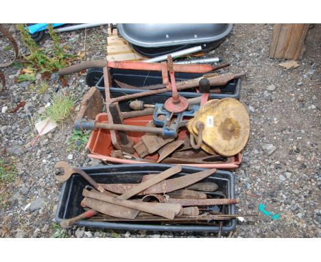 Three boxes of iron bars, old axe heads, timber roller, pulley plus old chainsaw cutter bars.