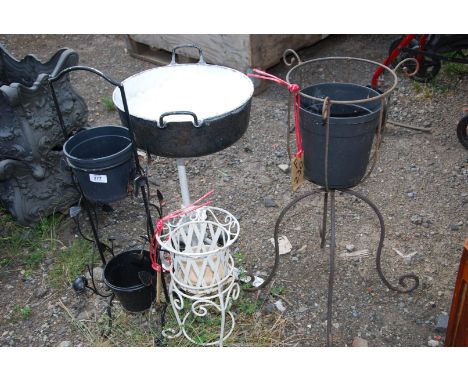 Enamel pot on cast base and three pot stands.