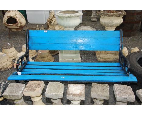A bench with blue painted cast ends, 48'' x 26'' high.
