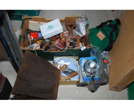 A box containing, a green tool roll, two tool aprons, blow lamp, old car spot lamp, assorted tools etc.