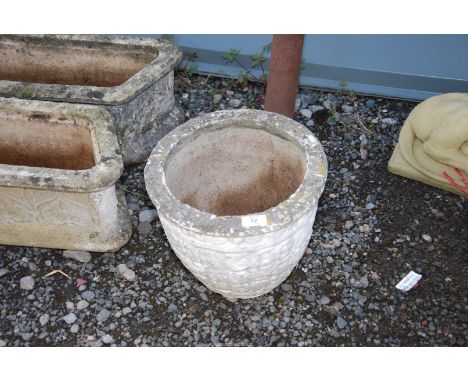 A round concrete planter.