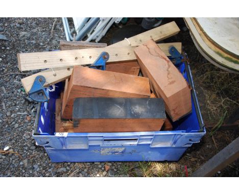 A large container of hardwood blocks, wooden sash clamps.