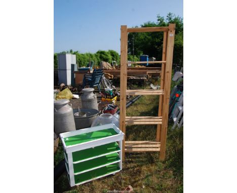 A five shelf unit and a green and white shelf unit.