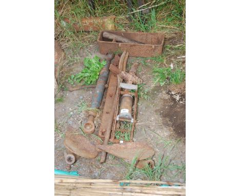 An old Cast Iron implement tool box, nail bar, two top links, foot pumps, Ferguson plough flays, etc.
