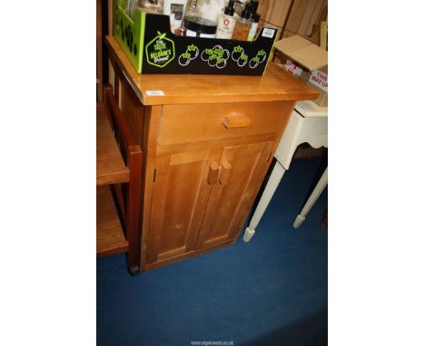 A light wood hall cupboard.