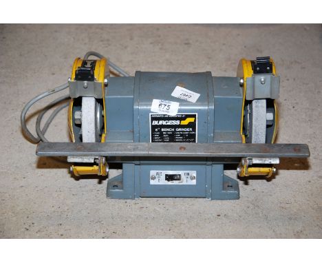 A Burgess 6'' bench grinder, no guard.