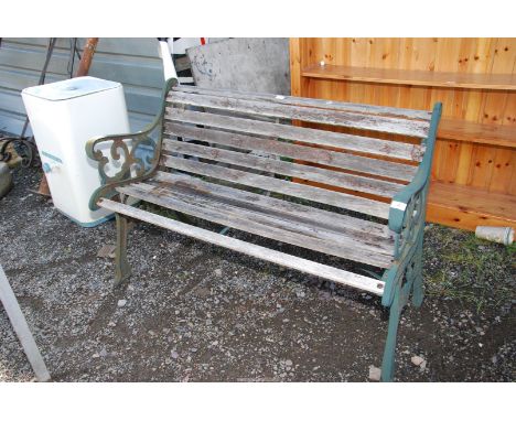 A wooden and cast iron end bench, 50'' wide x 29'' high.