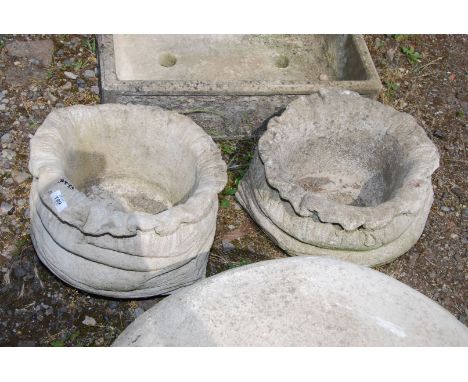 Two tree trunk shape concrete planters.
