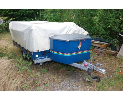 A trailer tent 'Flores 380R Acer', sleeps six, with awning, cooker and wash hand basin.