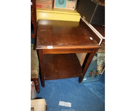 A square occasional table with lower shelf, on castors, 21 1/2" square x 26" high.