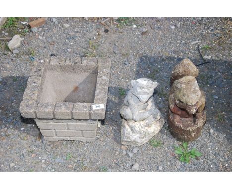 A square planter, a monkey and a squirrel.