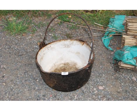 An old cast range pot, enamel inside.