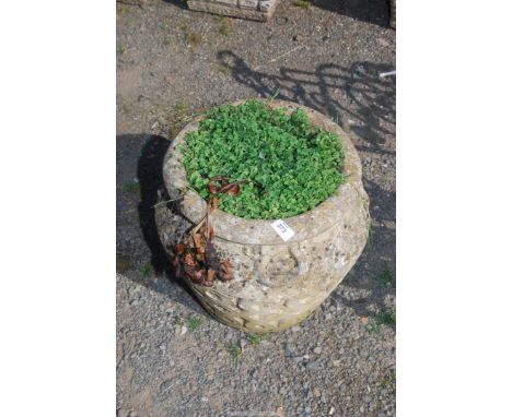 An urn shaped concrete planter with two stylised handles, 59 1/2'' high