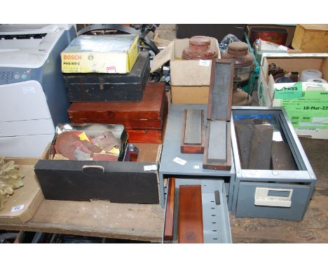 Wooden storage boxes, Bosch hot air gun, two Tilley lamps and two small filing drawers containing tool sharpening stones.