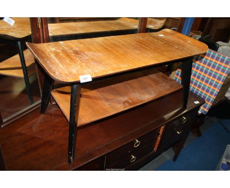 A 1960's coffee table with lower shelf.