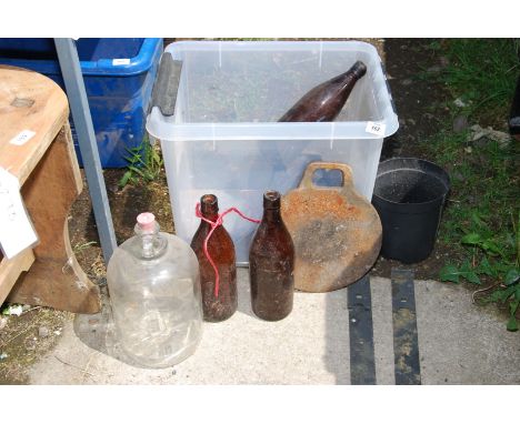 Old cider bottles, pair of large gate hinges, demi-john and griddle.