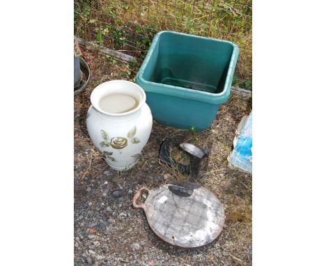 A shoe last, bake stone, planter and vase.