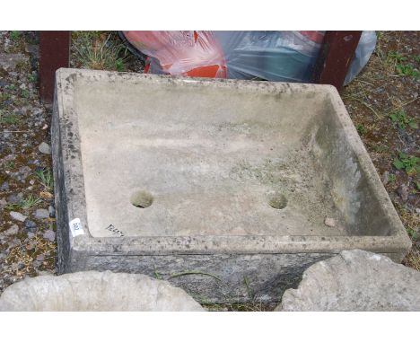 A concrete planter in the form of a sink, 27'' x 20'' x 7'' deep.