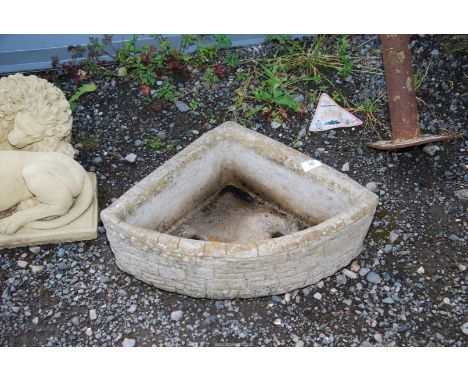 A concrete corner planter.