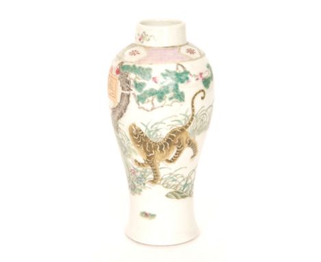 An early 20th Century Chinese vase decorated with a tiger prowling within a landscape, unmarked other than a real wax seal to