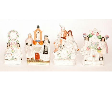 Four 19th Century Staffordshire flatbacks, comprising a pocket watch holder modelled as a nun and priest stood beside a churc