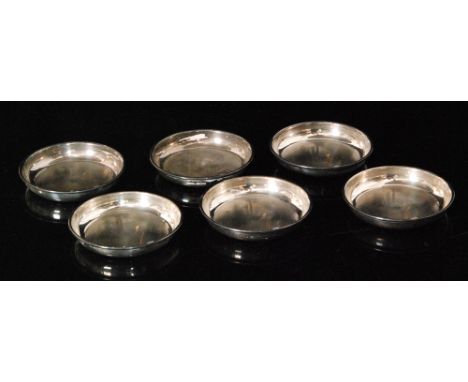 A set of six hallmarked silver coasters with engine turned decoration within plain borders, diameter 8cm, Birmingham 1971 S.J