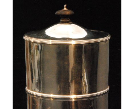 A hallmarked silver oval tea caddy of plain form with oval ebonised wooden finial to hinged cover, length 11cm, Chester 1898
