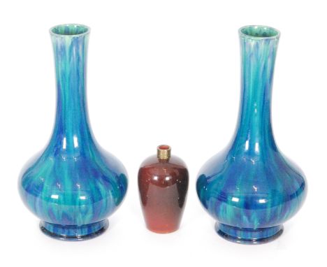 A 19th Century Ashworth Pottery vase decorated in a tonal red glaze with later applied brass collar neck, impressed mark, hei