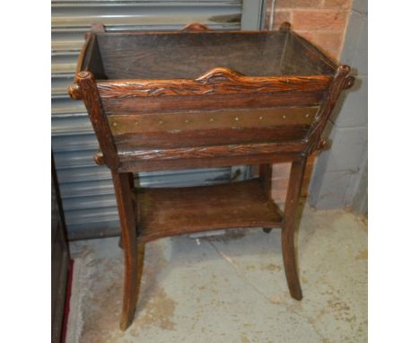 An oak jardinière stand or wine cooler in the Aesthetic style, of rectangular trough form above a stretcher shelf, height 91c
