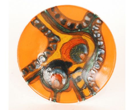 A Poole Pottery Delphis shape 4 shallow bowl decorated in the typical manner with a bright abstract pattern over an orange gr