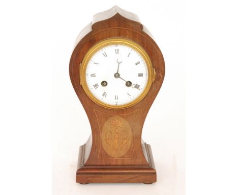 An Edwardian mahogany eight day strike balloon mantle clock, Roman numerals to a white enamelled dial above inlaid foliate de