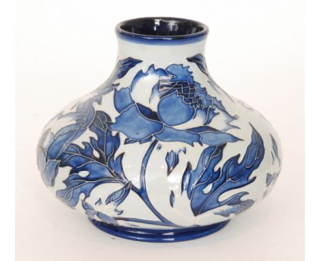 A Moorcroft Pottery vase of compressed form decorated in the Midnight Blue and Peony pattern (from the Midsummer Surprise col