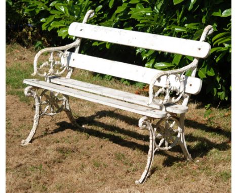 A late 19th to early 20th Century cast iron garden bench with swans head capitals above a foliate scroll frame, width 120cm.