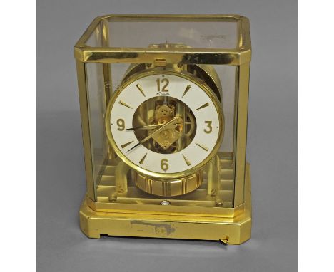 A JAEGER LECOULTRE ATMOS CLOCK, of traditional design,  the 5" dial with skeletonised centre above a large balance wheel and 