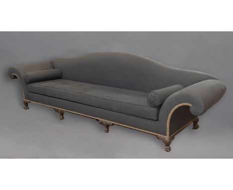 A LARGE UPHOLSTERED SCROLL END SOFA, the camel back above one single long seat cushion, the frames with rows of metal studs o
