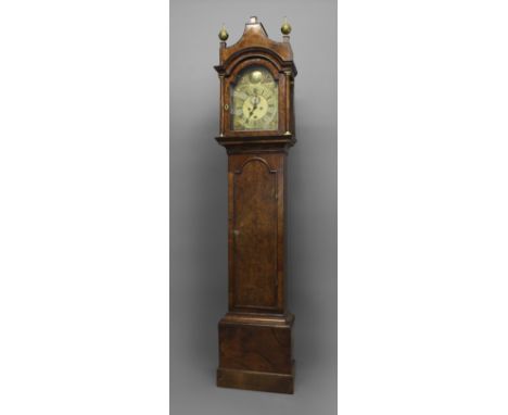 AN EARLY 18TH CENTURY WALNUT LONGCASE CLOCK, the 11" brass dial with date aperture and subsidiary seconds dial, with scrollin