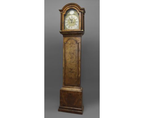 A WALNUT LONGCASE CLOCK, late 18th or early 19th century, the 11 1/2" dial with silvered chapter ring, date aperture and subs