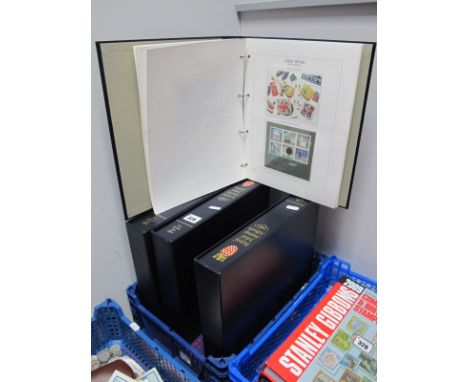 A Mint G.B. Stamp Collection, Definite, Commemorative and Regional in four high quality pre-printed with mounts British Post 