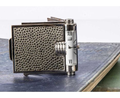 A modern Dunhill quartz travel clock, folding case with black shagrine panels, clock within hinge, 6.4cms closed